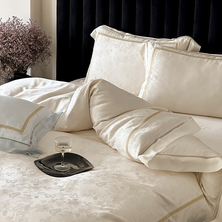 Luxuriöse Baumwollsatin-Bettwäschegarnitur mit Jacquard-Blütenmuster und bestickter Bordüre