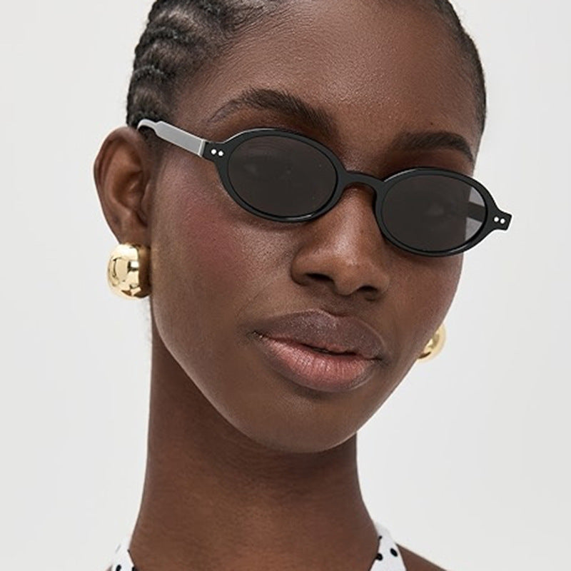 Damen modische ovalförmige Sonnenbrille mit ausgefallenem Rahmen Karnz