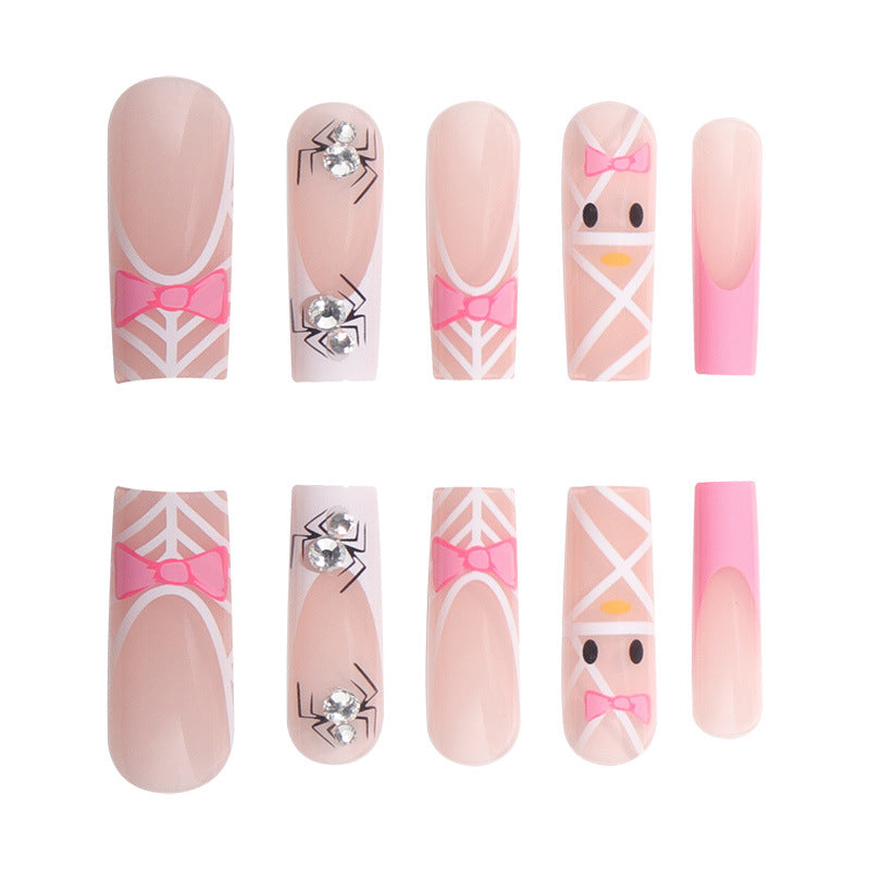 Künstlerische Press-On-Nagelerweiterungen mit Spinnen- und Schleifen-Design Karnz