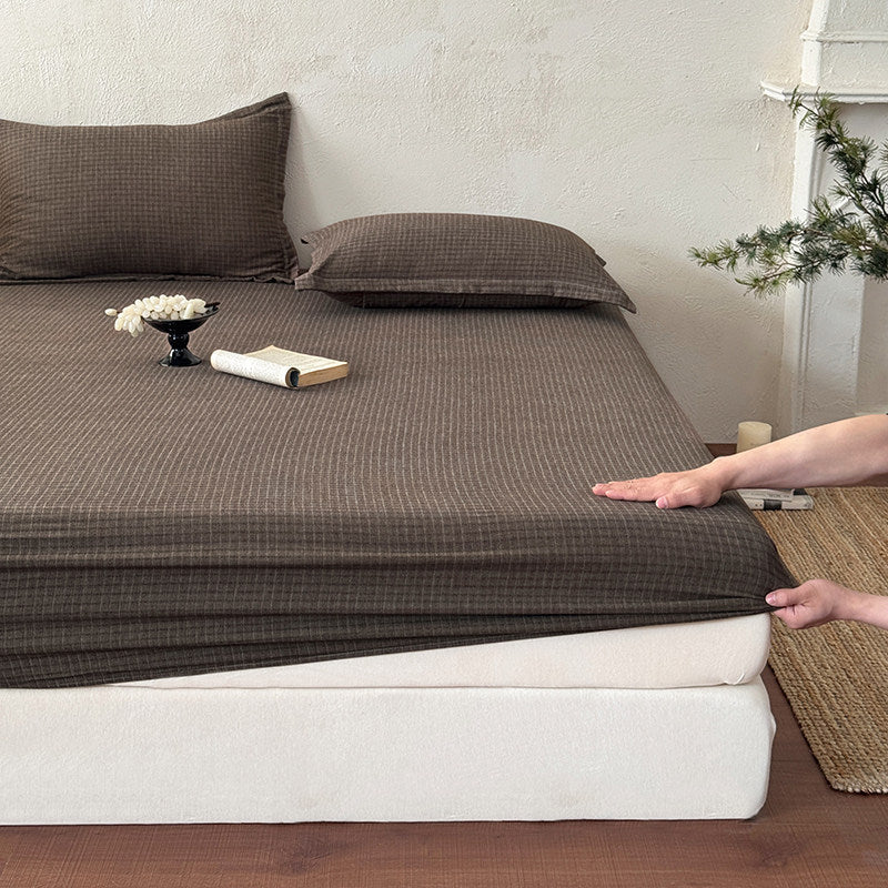 Elastisches Spannbettlaken aus Baumwoll‑Jersey mit tiefem Steg und dehnbarer Rundumgummierung
