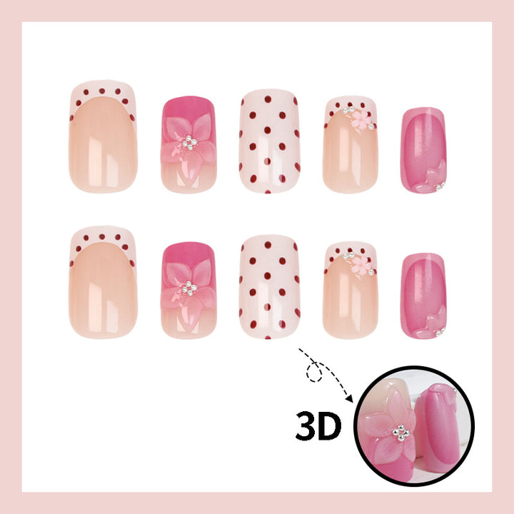 Kunstnagelset mit verspielten Blüten- und Punktmotiv Karnz