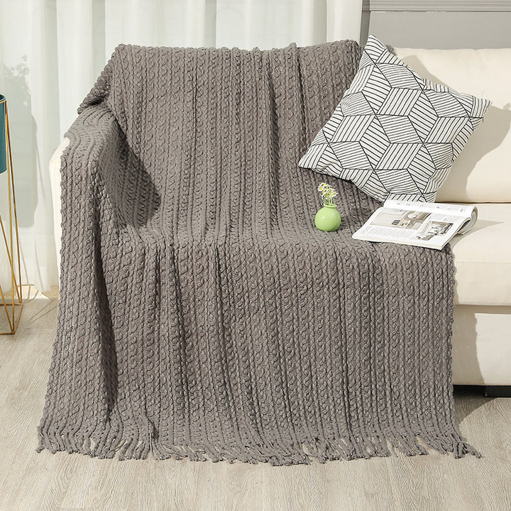 Strukturierte Strickwurfdecke