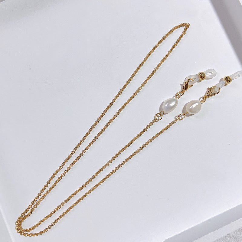 Elegante Schmuckhalterkette mit Perlen- und Goldakzenten Karnz