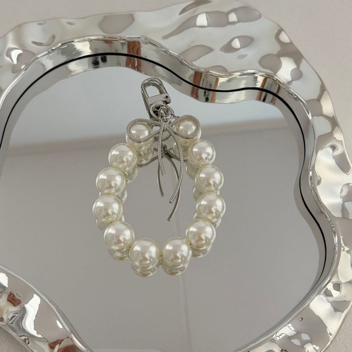 Eleganter Perlencharms-Schlüsselanhänger Karnz
