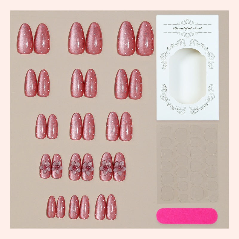 Kunstnagelset mit glamourösem Glitzer-Design und floralem Akzent Karnz