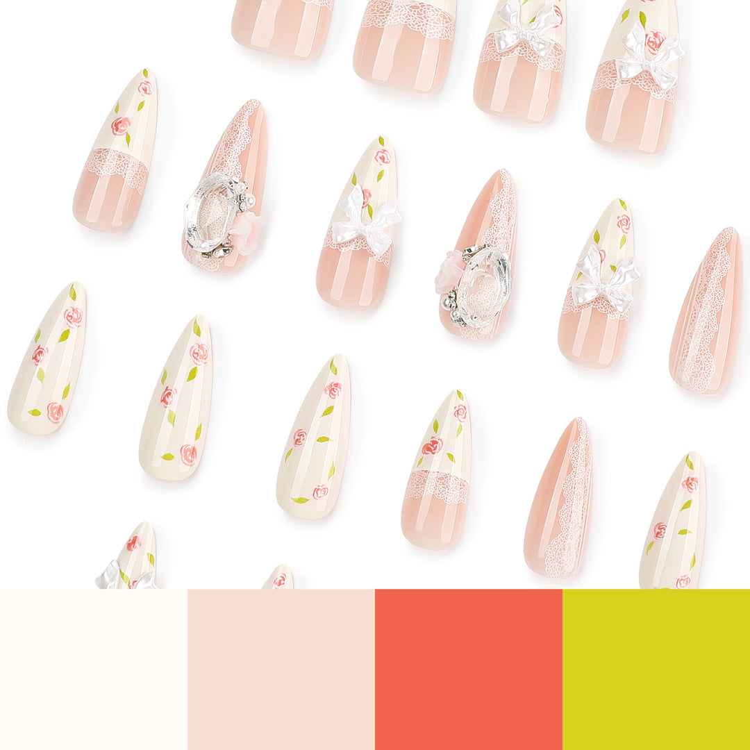 Kunstvolle Stiletto-Nägel mit floralen Akzenten und Glitzerakzenten Karnz