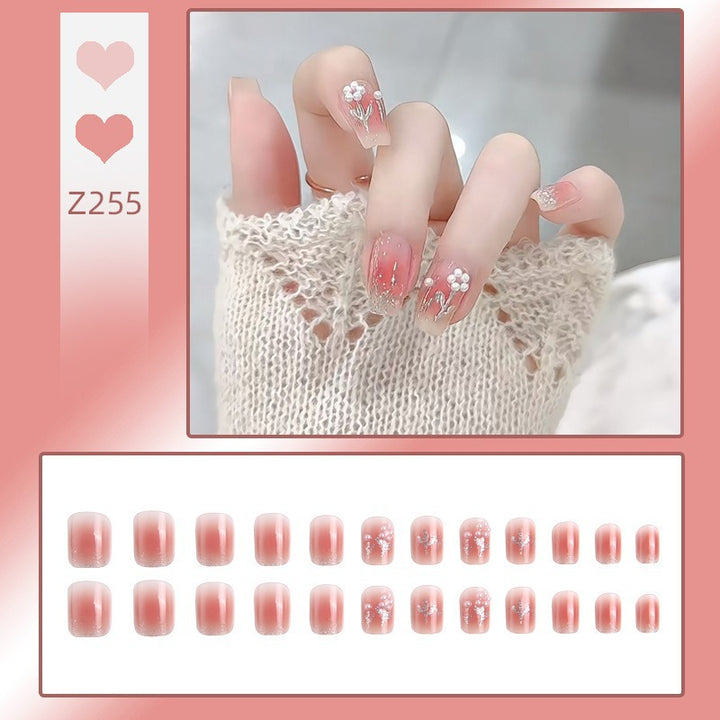 Kunstnagelset mit floralen Designs und Glitzerakzenten Karnz