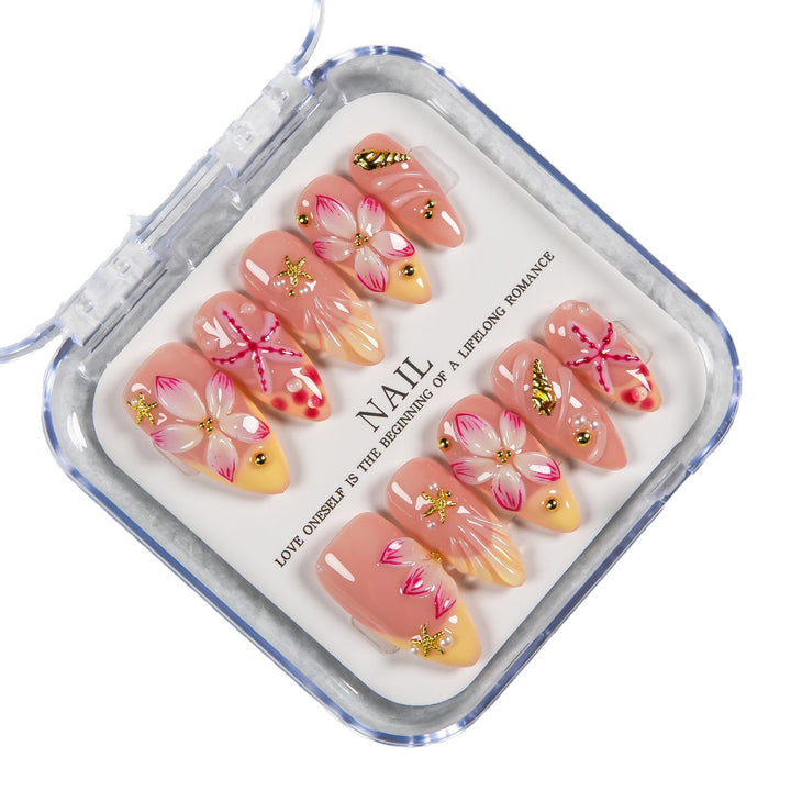 Dekoratives Press-On Nagelset mit floralen und Strandakzenten