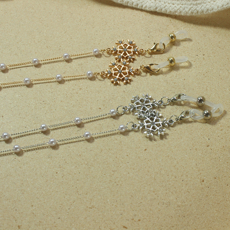 Elegante Brillenhalterkette mit Perlen und Schneeflockenanhänger Karnz