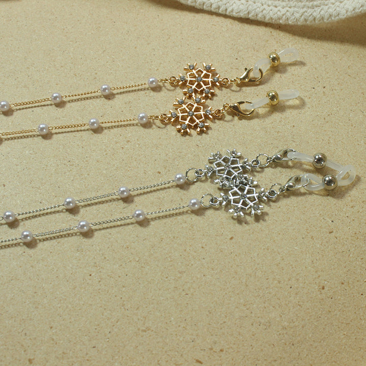 Elegante Brillenhalterkette mit Perlen und Schneeflockenanhänger Karnz