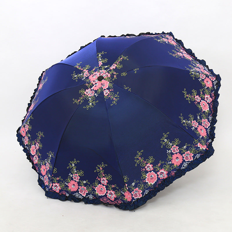 Damen Regenschirm mit fröhlichem Blumendruck und Wellenrand Karnz