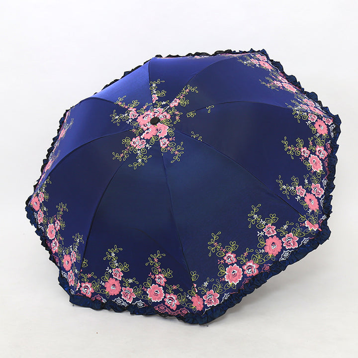 Damen Regenschirm mit fröhlichem Blumendruck und Wellenrand Karnz