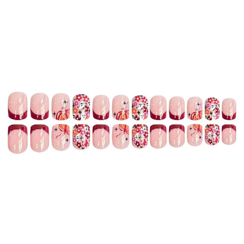Kunstnagelset mit fröhlichen Blumenmotiven und eleganten French-Spitzen Karnz