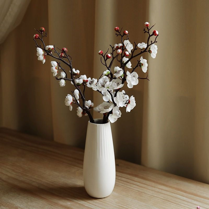 Dekorative Blumenäste Arrangement