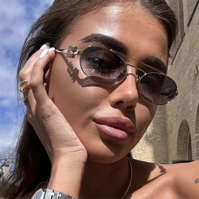 Damen elegante ovale Sonnenbrille mit luxuriösem Metallrahmen Karnz