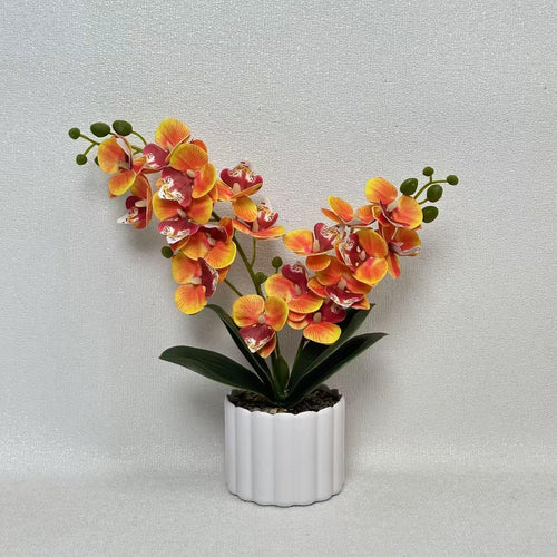 Elegante künstliche Orchideenpflanzenanordnung für die Innendekoration
