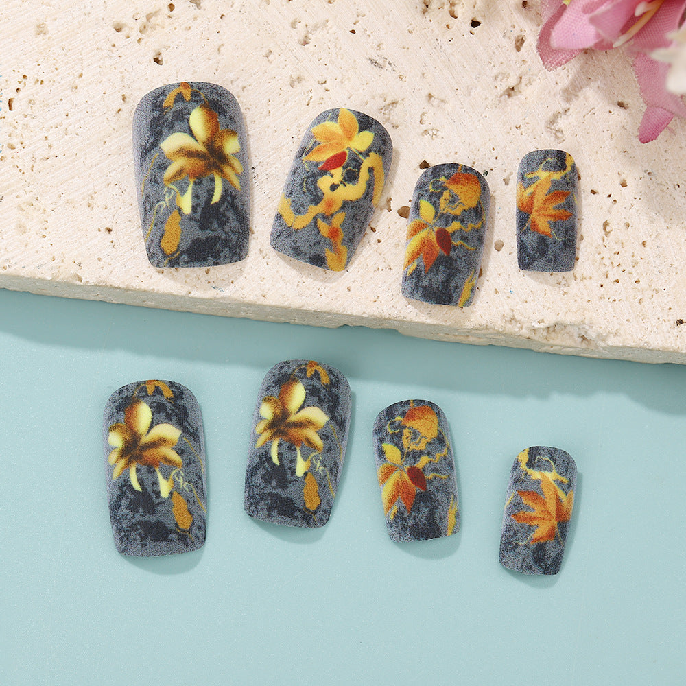 Kunstnägel mit bunten Blumenmotiven Karnz