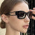 Damen modische Katzenaugen-Sonnenbrille mit stilvollem Rahmen und UV-Schutz Karnz
