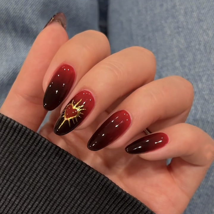 Kunstnagelset mit glamourösem Herz- und Sonnenmotiv Karnz