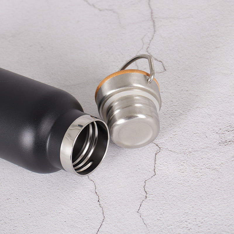 Damen Edelstahl Trinkflasche mit Bambusdeckel und Tragegriff Karnz