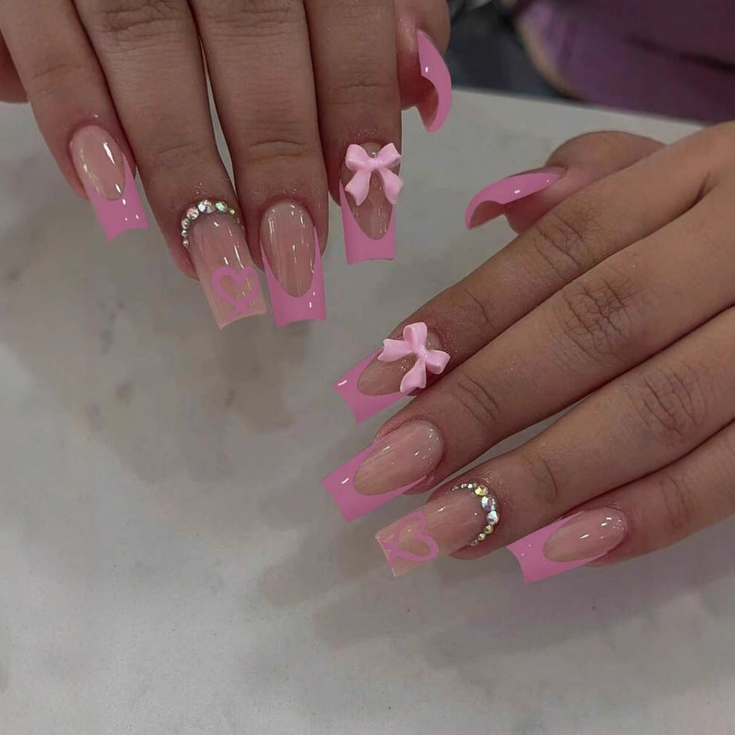 Kunstnagelset mit romantischen Schleifen- und Herzmotiven Karnz