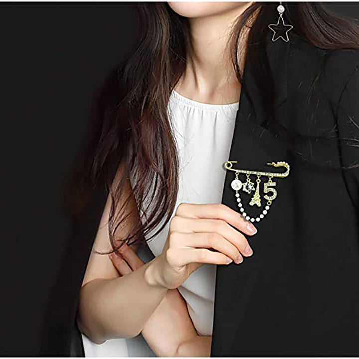 Elegante Brosche mit Perlen und Strass Karnz