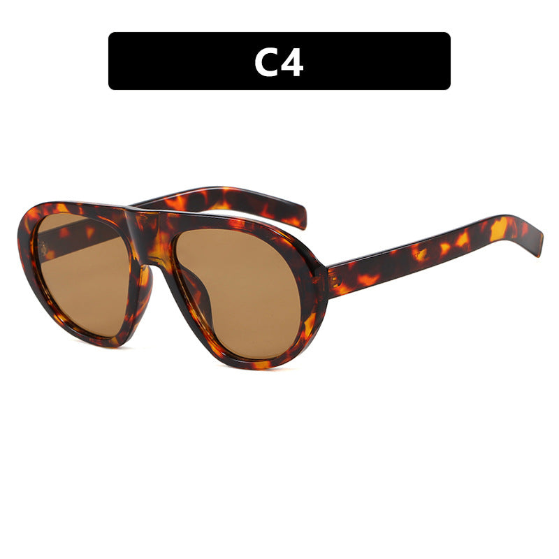 Damen auffällige Sonnenbrille mit futuristischem Rahmen und robustem Design Karnz