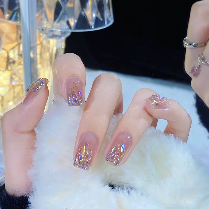 Kunstnagelset mit glitzernden holografischen Akzenten Karnz