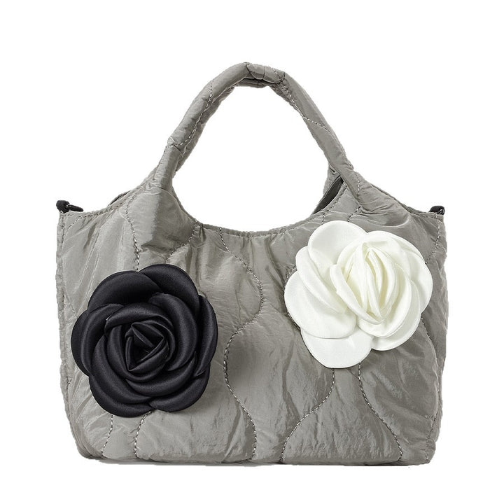 Blumengeschmückte gesteppte Handtasche