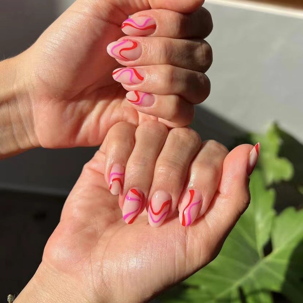 Künstlerisches Press-On-Nagelset mit kreativem Wirbel-Design Karnz