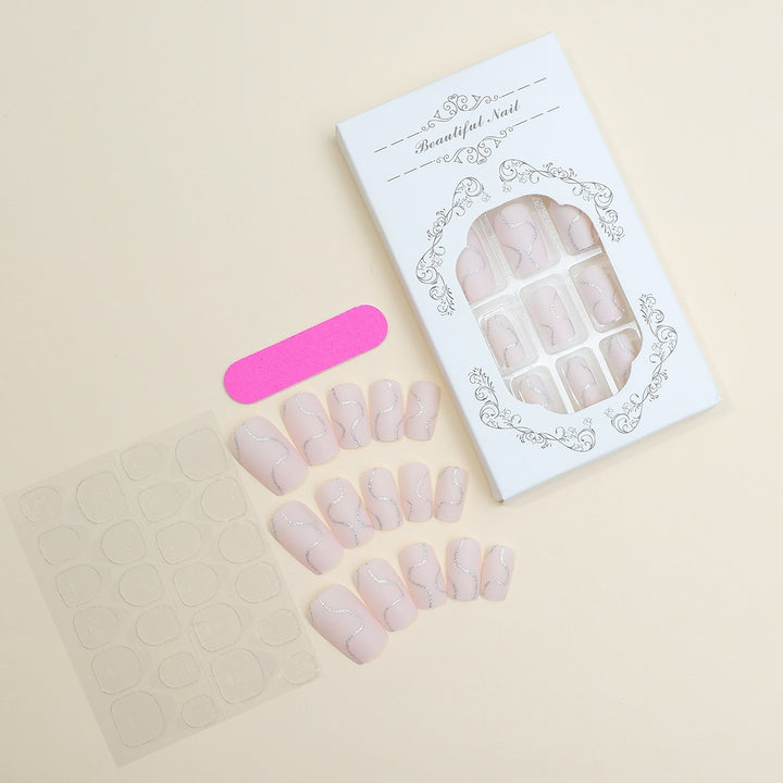 Künstliches Nagelset mit eleganten Linien und Glitzerakzenten Karnz