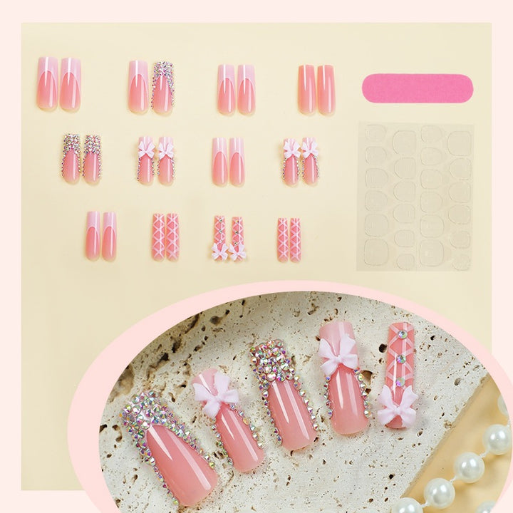 Kunstnagelset mit Glitzer- und Schleifenmotiv Karnz