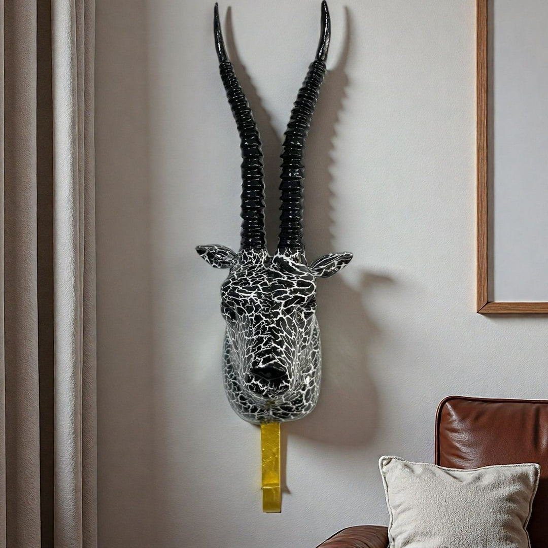 Wandhaken in Form eines stilisierten Einhorns Karnz