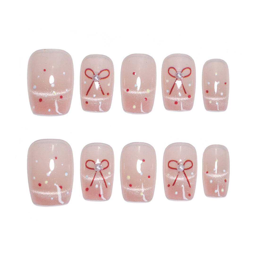 Künstliche Nagelkunst mit eleganten Schleifen und Glitzerakzenten Karnz