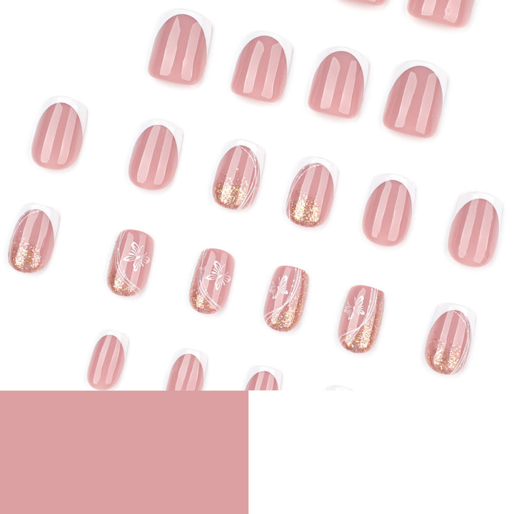 Elegante Nagelverlängerungen mit Glitzer und Blumen-Motiven Karnz