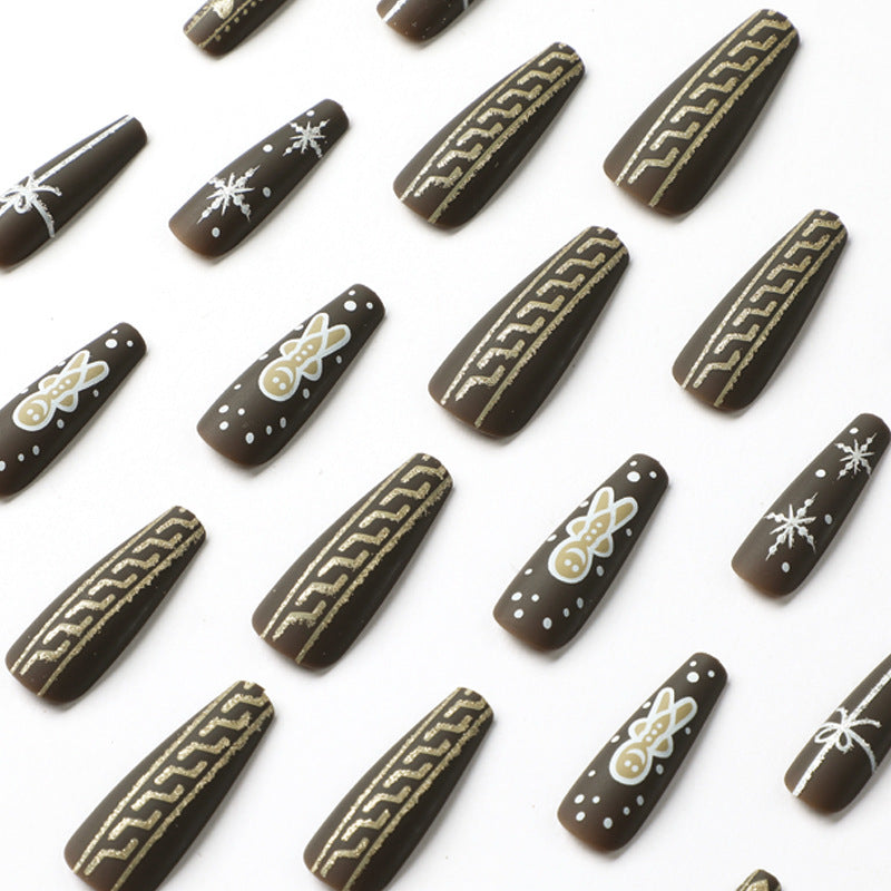 Künstliche Nagelkunst mit festlichem Lebkuchen-Design Karnz