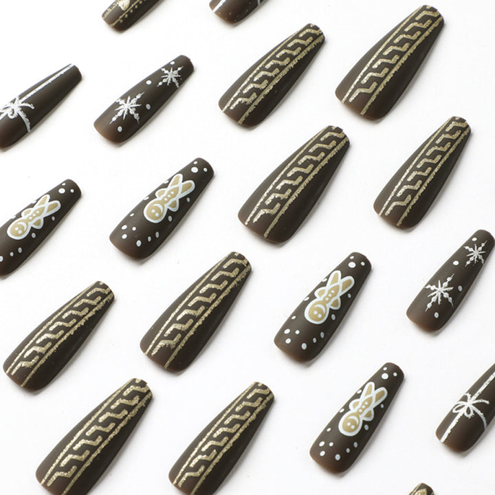 Künstliche Nagelkunst mit festlichem Lebkuchen-Design Karnz
