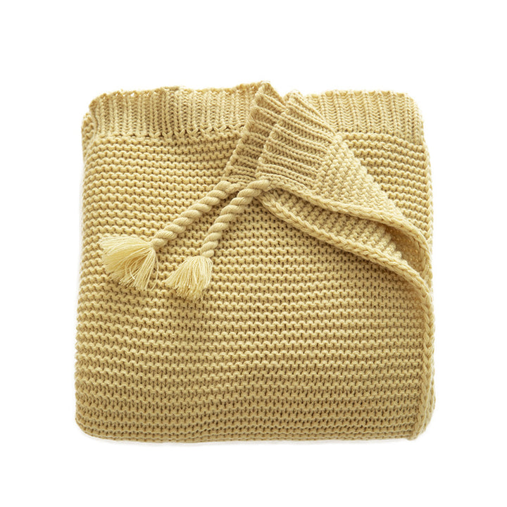 Grobgestrickte Kuscheldecke mit Rautenmuster und bunten Knötchen
