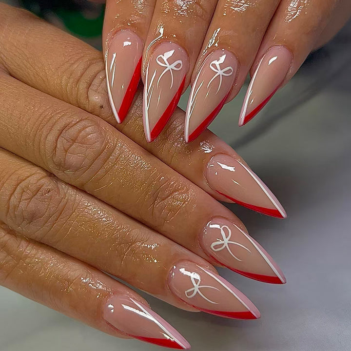 Kunstfingernägel Im Eleganten Stiletto-Design mit Schleifen-Akzenten Karnz