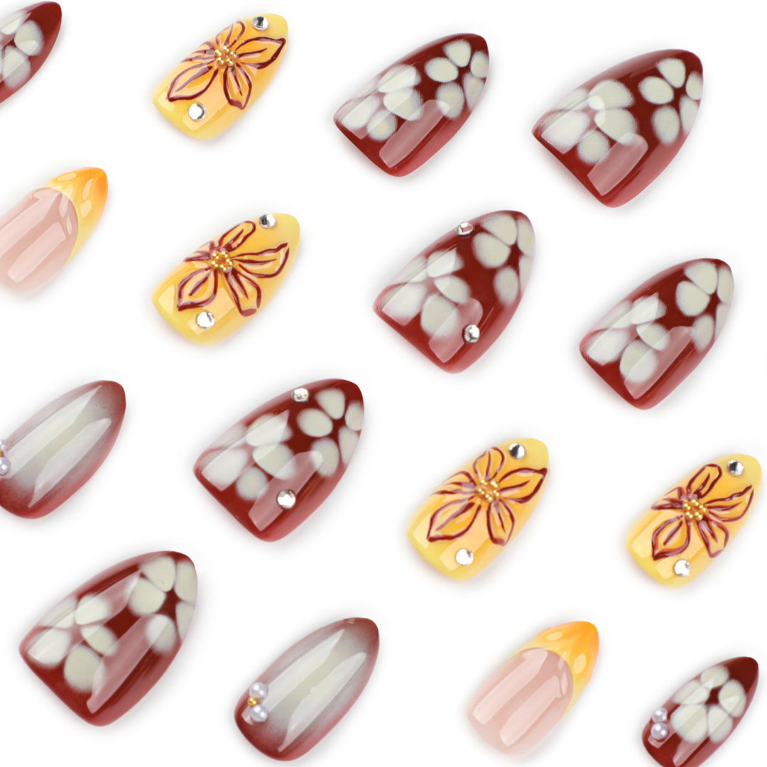 Künstliche Nagelverlängerungen mit floralem Design und Strassverzierungen Karnz