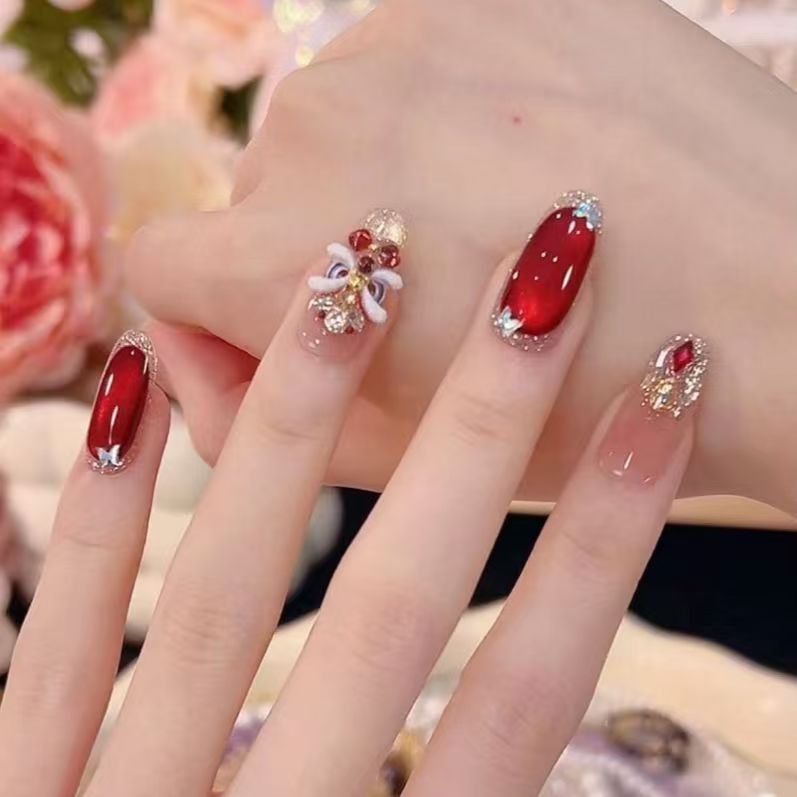 Künstlerische mit Strass veredelte Nagelverlängerungen Karnz