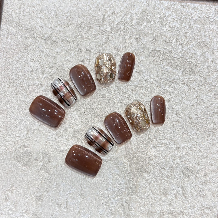Kunstnägel-Set mit Glitzer- und Goldakzenten Karnz