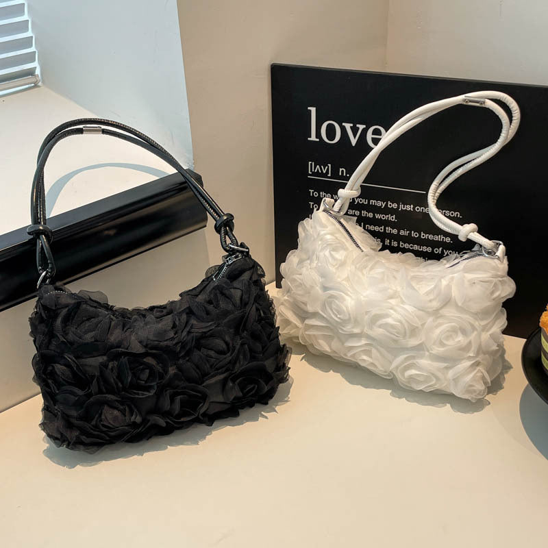 Blumenverzierte Handtasche