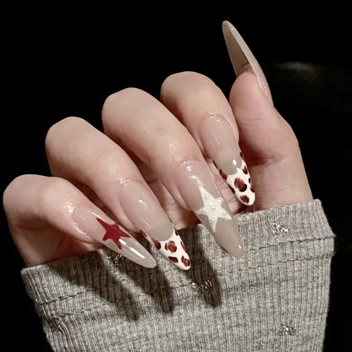 Künstlerische Stiletto Press-On Nägel mit Stern- und Tiermustern Karnz