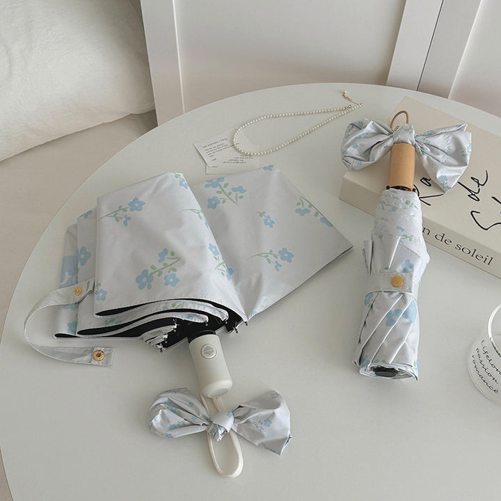 Damen Faltender Regenschirm mit stilvollem Blumendesign Karnz