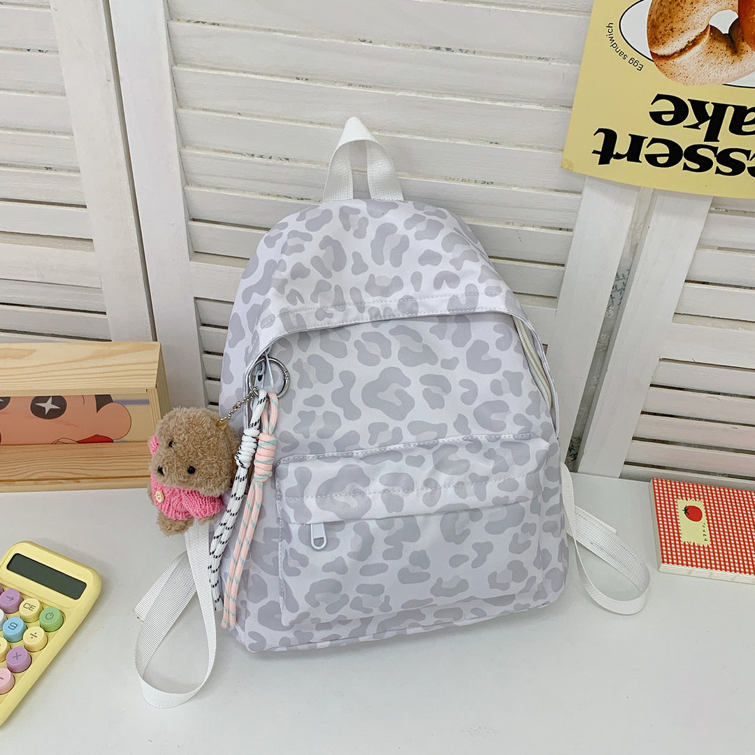 Verspielt gepunkteter Mini-Rucksack