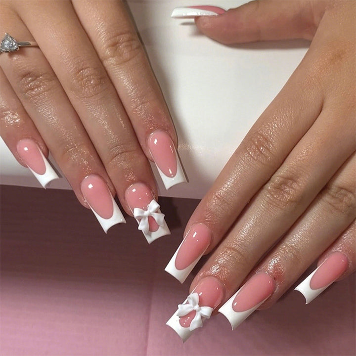 Elegantes Press-On Nagelset mit dekorativen Schleifen Karnz