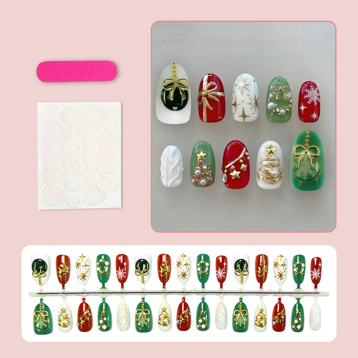 Kunstnagelset mit festlichen Weihnachtsmotiven und glamourösen Goldverzierungen Karnz