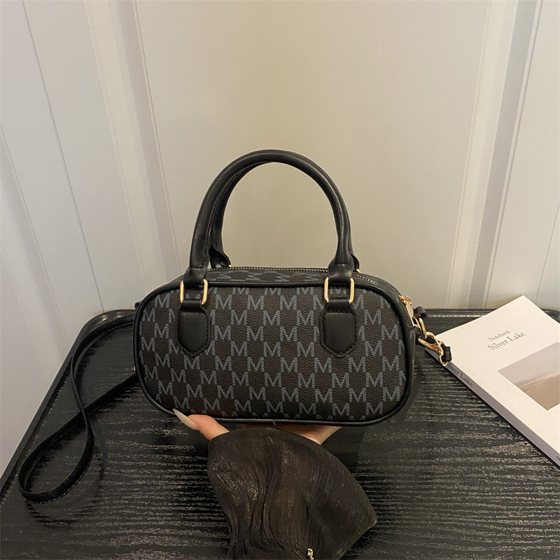 Stylische Monogram-Handtasche