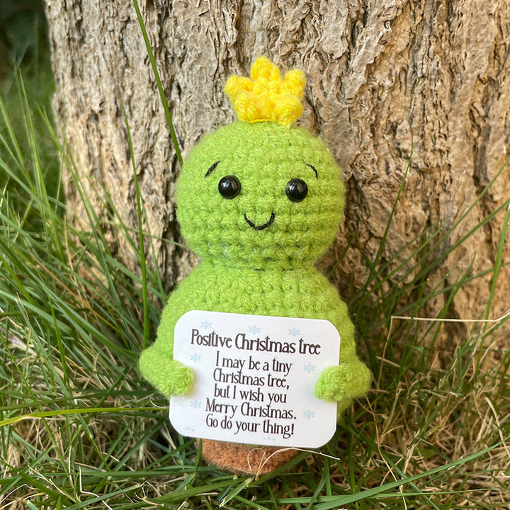 Plüschknuffel mit Weihnachtsmannhut und Schal